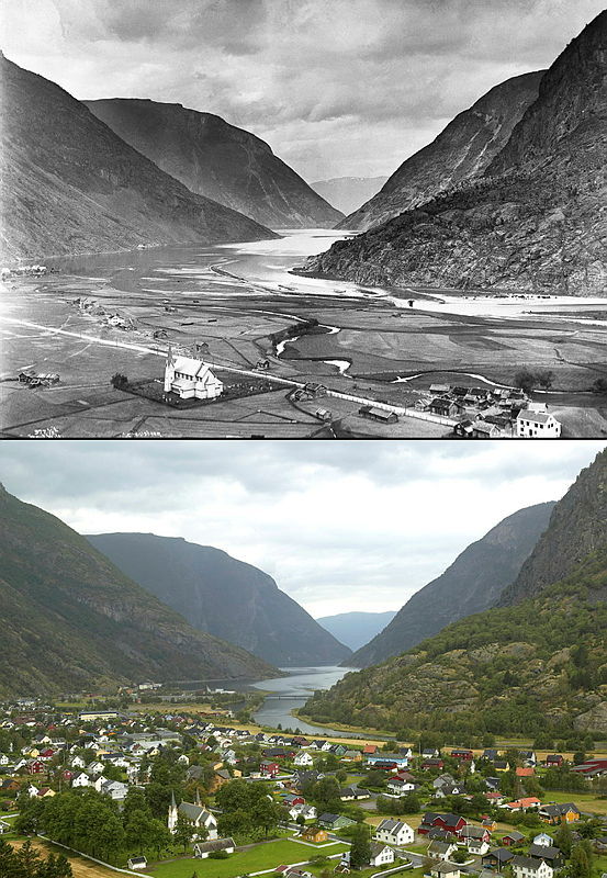 Landskap med tettsted og fjell og fjord